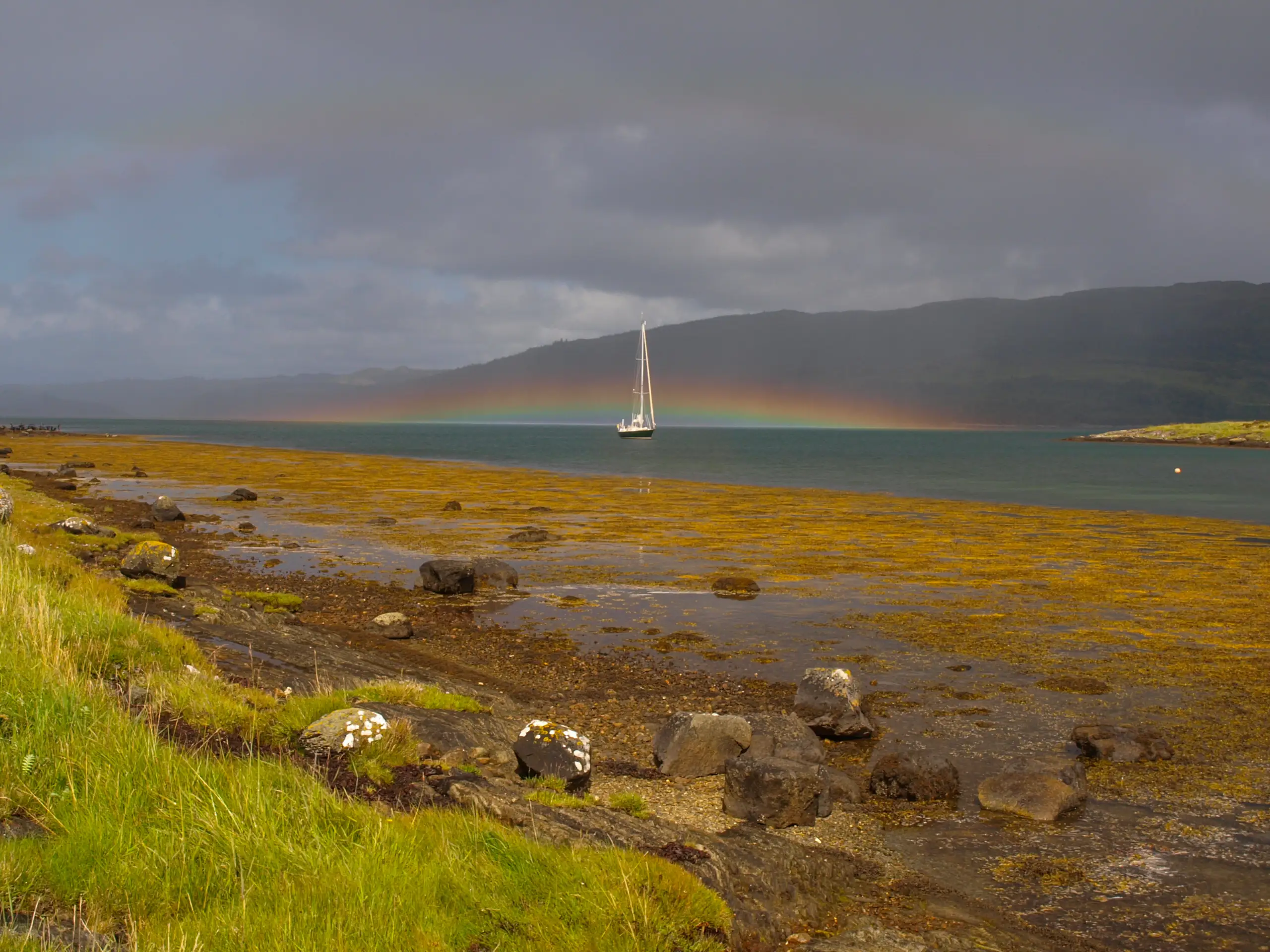 Pickle at anchor with rainbow