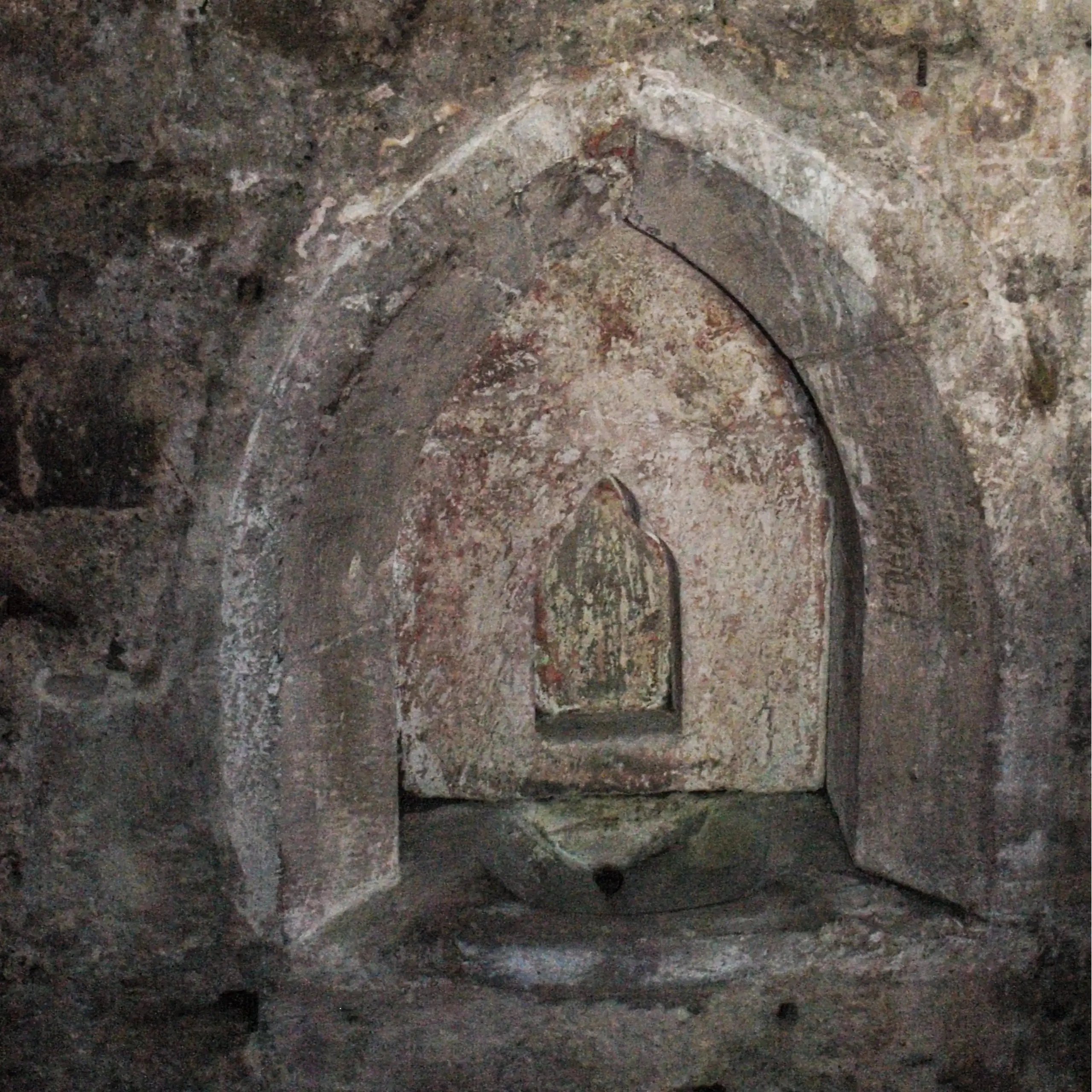 The medieval piscina in St Moluag's