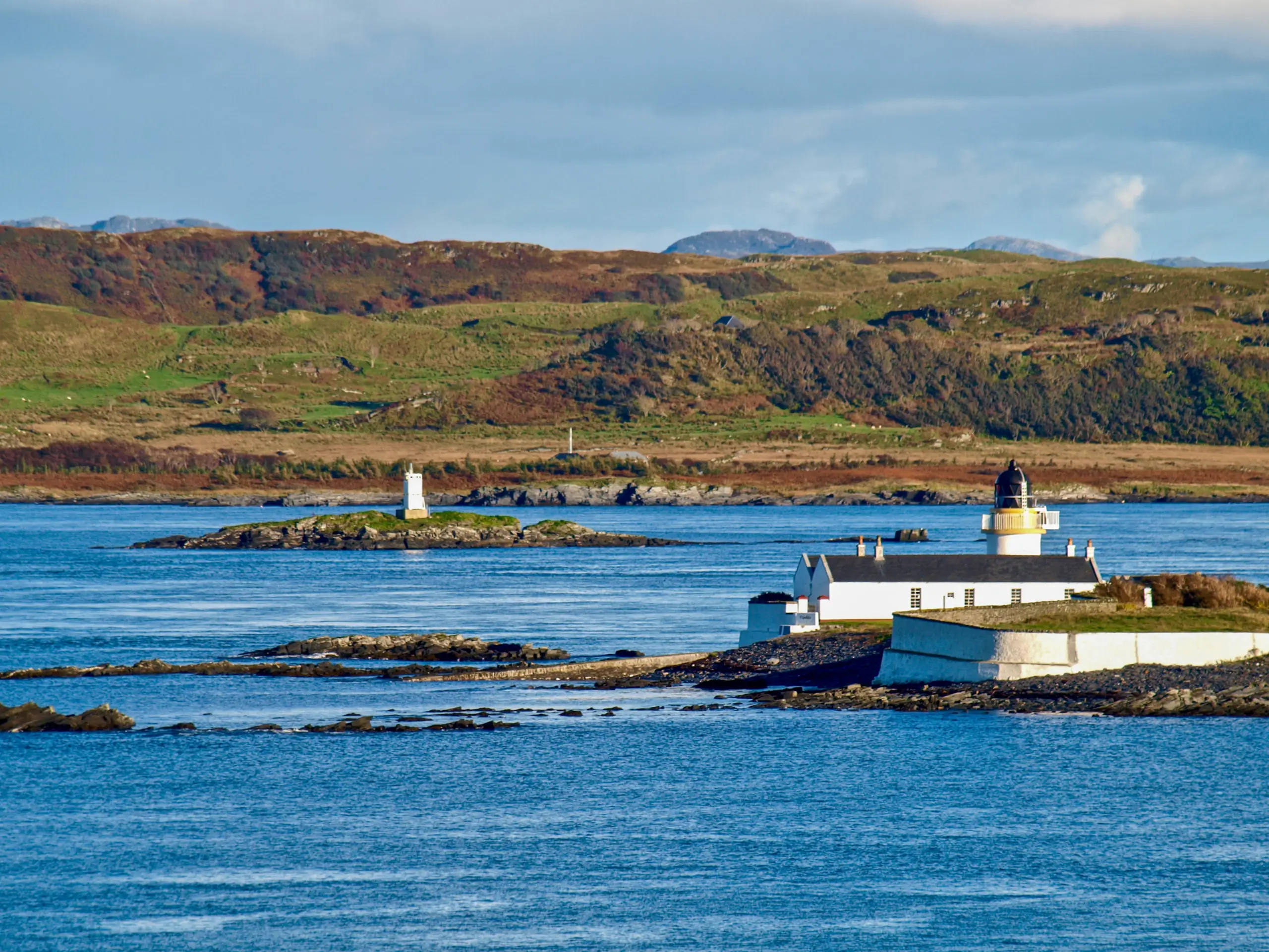Looking over to the Fladda light and the strong tide rushing past it